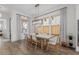 Bright dining room with modern lighting, neutral accents, and large windows bringing in natural light at 4114 Maidstone Dr, Mount Pleasant, SC 29466