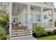 Inviting front porch with pendant light, ceiling fan, and steps leading to the entry of this beautiful home at 4114 Maidstone Dr, Mount Pleasant, SC 29466