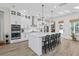 Spacious kitchen with a large island, seating, white cabinets, and stainless steel appliances at 4114 Maidstone Dr, Mount Pleasant, SC 29466
