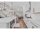 Modern kitchen with white cabinets, a large island with quartz countertops, and stainless steel appliances at 4114 Maidstone Dr, Mount Pleasant, SC 29466