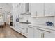 Modern kitchen features white cabinets, stainless steel appliances, and quartz countertops at 4114 Maidstone Dr, Mount Pleasant, SC 29466