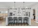 Bright kitchen features a large island, white cabinets, stainless steel appliances, and pendant lighting at 4114 Maidstone Dr, Mount Pleasant, SC 29466