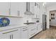 Bright kitchen features white cabinets, stainless steel appliances, and hardwood flooring at 4114 Maidstone Dr, Mount Pleasant, SC 29466