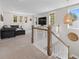 Upstairs living room with large windows, a comfortable couch and plenty of natural light at 4114 Maidstone Dr, Mount Pleasant, SC 29466