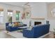 Stylish living room with a fireplace, natural light, and comfortable seating for relaxation and entertainment at 4114 Maidstone Dr, Mount Pleasant, SC 29466