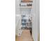 Organized walk-in pantry with custom shelves and white cabinets offers ample storage solutions at 4114 Maidstone Dr, Mount Pleasant, SC 29466