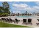 Relaxing view of the pool, complete with plenty of lounge chairs, umbrellas, splash features, and various seating areas at 4114 Maidstone Dr, Mount Pleasant, SC 29466