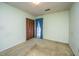 Bedroom with large closet and window with teal curtains and tan carpet at 4328 Cheviot Dr, North Charleston, SC 29418