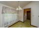 Bright dining room features an adjacent doorway and a window with patterned curtains at 4328 Cheviot Dr, North Charleston, SC 29418