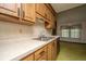 Kitchen featuring stainless steel sink, faucet, dishwasher, and light wood cabinets at 4328 Cheviot Dr, North Charleston, SC 29418