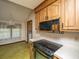 Kitchen featuring a stainless steel sink, cooktop, wood cabinets, and a dining area at 4328 Cheviot Dr, North Charleston, SC 29418