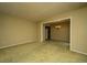 Open-concept living space with carpeted floors, neutral paint, and a chandelier fixture at 4328 Cheviot Dr, North Charleston, SC 29418