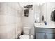 Clean bathroom features a shower with curtain, and a mirrored vanity at 4404 Avery Ave, North Charleston, SC 29405