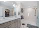 Elegant bathroom with a double sink vanity and a modern glass-enclosed shower at 4404 Avery Ave, North Charleston, SC 29405