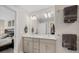 Well-lit bathroom featuring a double vanity and access to the primary bedroom at 4404 Avery Ave, North Charleston, SC 29405