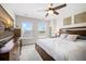 Comfortable bedroom featuring a ceiling fan, neutral walls, and natural light at 4404 Avery Ave, North Charleston, SC 29405