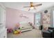Adorable Bedroom with a white crib, soft pink walls, and elephant-themed decor at 4404 Avery Ave, North Charleston, SC 29405