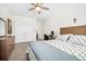 Spacious bedroom with carpeted floors features dual closets and a ceiling fan at 4404 Avery Ave, North Charleston, SC 29405