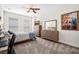 Cozy bedroom features neutral decor, carpeted floors, and a ceiling fan at 4404 Avery Ave, North Charleston, SC 29405