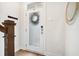 Bright entryway featuring a modern frosted glass front door and hardwood floors at 4404 Avery Ave, North Charleston, SC 29405