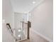 Bright hallway with neutral walls and carpet, leading to a doorway with outdoor view at 4404 Avery Ave, North Charleston, SC 29405