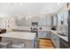 Kitchen with stainless steel appliances, gray cabinets, white countertops, and island at 4404 Avery Ave, North Charleston, SC 29405