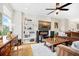 Bright living room with hardwood floors features a decorative fireplace and modern shelving at 4404 Avery Ave, North Charleston, SC 29405