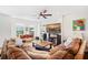 Bright living room with hardwood floors and a large comfortable couch at 4404 Avery Ave, North Charleston, SC 29405