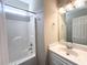 Bathroom featuring tub/shower combination, mirror, vanity with storage, and neutral wall color at 4818 Holly Berry Ln, Summerville, SC 29485