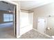 Bathroom featuring a tub-shower, storage closet, neutral walls, and tiled floors at 4818 Holly Berry Ln, Summerville, SC 29485