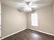 The bedroom features wood-look flooring, neutral paint, and a window for natural light at 4818 Holly Berry Ln, Summerville, SC 29485