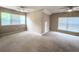 Spacious room with natural light, neutral walls, carpet and ceiling fans at 4818 Holly Berry Ln, Summerville, SC 29485