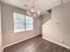 The dining area features wood-look flooring, a modern chandelier, and ample natural light at 4818 Holly Berry Ln, Summerville, SC 29485