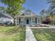 Charming house with a covered front porch, beautiful landscaping and a walkway at 4818 Holly Berry Ln, Summerville, SC 29485