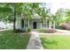 Charming home with mature trees, a sidewalk to front door, and manicured lawn at 4818 Holly Berry Ln, Summerville, SC 29485