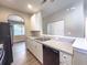 The kitchen has stainless steel sink, granite-look counters and access to the dining room with closet pantry at 4818 Holly Berry Ln, Summerville, SC 29485