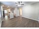 Open-concept design integrates the kitchen into the living space with wood-look floors and neutral paint at 4818 Holly Berry Ln, Summerville, SC 29485