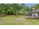 Expansive backyard with a deck and outdoor seating offers a perfect spot for relaxation and entertaining at 4924 France Ave, North Charleston, SC 29405