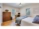 Comfortable bedroom with wood floors, a desk, and a chest of drawers offers ample storage at 4924 France Ave, North Charleston, SC 29405