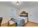 Cozy bedroom with wainscoting, a tufted headboard, and a charming wooden chest at 4924 France Ave, North Charleston, SC 29405