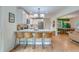 Bright kitchen features a breakfast bar, white cabinets, stainless steel appliances, and an open layout at 4924 France Ave, North Charleston, SC 29405