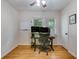 Bright home office features hardwood floors, a modern desk, and a comfortable ergonomic chair at 4924 France Ave, North Charleston, SC 29405