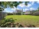 Expansive backyard featuring lush green lawn and privacy fence, perfect for outdoor entertaining at 4977 Ballantine Dr, Summerville, SC 29485
