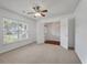 Cozy bedroom with carpet, ceiling fan, and double door closet at 4977 Ballantine Dr, Summerville, SC 29485
