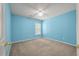 Comfortable bedroom featuring blue walls, carpet, and a ceiling fan at 4977 Ballantine Dr, Summerville, SC 29485