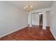 Dining room with hardwood floors, chandelier, and stairway access at 4977 Ballantine Dr, Summerville, SC 29485