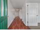 Bright hallway with hardwood floors, neutral paint, and well-lit entryway at 4977 Ballantine Dr, Summerville, SC 29485