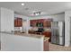 Modern kitchen with stainless steel appliances, granite counters, and bar seating, ideal for casual dining at 4977 Ballantine Dr, Summerville, SC 29485