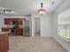 Bright kitchen with stainless steel appliances, and granite countertops, adjacent to a dining area and access to the backyard at 4977 Ballantine Dr, Summerville, SC 29485