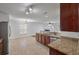 The kitchen features stainless steel appliances and granite countertops, perfect for cooking and entertaining at 4977 Ballantine Dr, Summerville, SC 29485